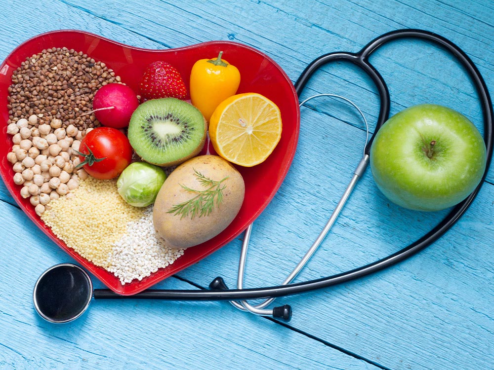 bowl of healthy food and stethoscope